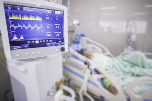 Destiny in hospital bed on life support